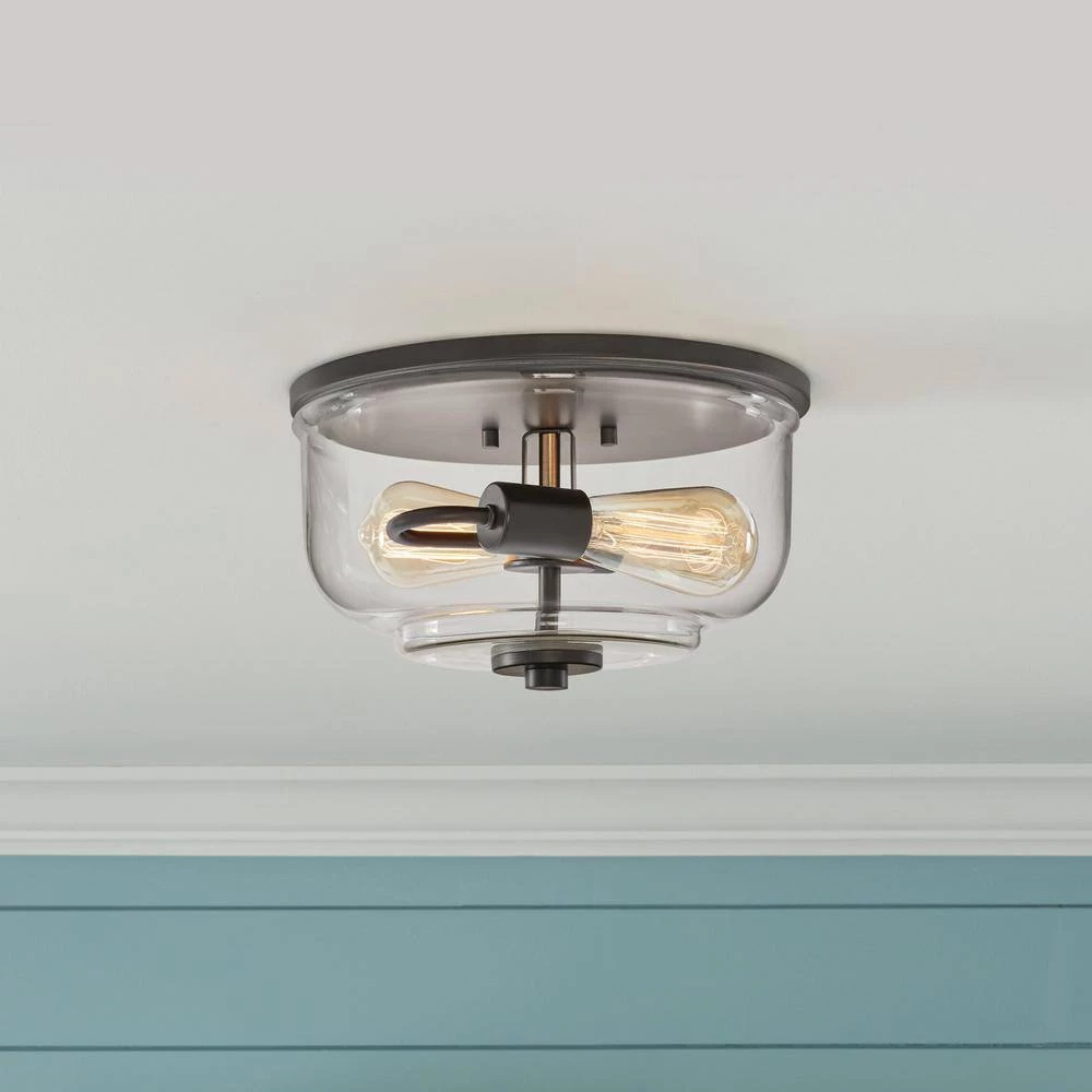 Knollwood 12 in. 2-Light Blackened Bronze Industrial Flush Mount with Vintage Brass Accents and Clear Glass Shade by Home Decorators Collection 4 Knollwood 12 in. 2-Light Blackened Bronze Industrial Flush Mount with Vintage Brass Accents and Clear Glass Shade by Home Decorators Collection - Image 2